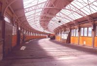 A view down the covered way from Wemyss Bay station to the pier.The glass fronted display units contain the ornamental embellishments from the paddle boxes of long departed paddle steamers.1985<br><br>[John Gray //1985]