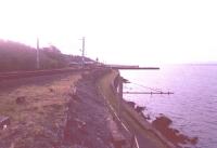 Wemyss Bay.A picture taken from the remains of the signal box. On the lower right the trackbed of the line which led to the goods shed and the coal merchants sidings.The remains of a loading gauge can be seen. 1985.<br><br>[John Gray //1985]