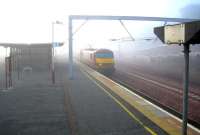 <h4><a href='/locations/C/Carstairs'>Carstairs</a></h4><p><small><a href='/companies/C/Caledonian_Railway'>Caledonian Railway</a></small></p><p>Out of the early morning mist and into Carstairs station on 6 June 2006 at precisely 0620 (5 minutes ahead of schedule) comes 90028 with the 15 coaches of the combined Edinburgh & Glasgow Lowland Sleeper. 20/42</p><p>06/06/2006<br><small><a href='/contributors/John_Furnevel'>John Furnevel</a></small></p>