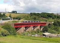 <h4><a href='/locations/J/Jamestown_Viaduct_Inverkeithing'>Jamestown Viaduct [Inverkeithing]</a></h4><p><small><a href='/companies/F/Forth_Bridge_Railway'>Forth Bridge Railway</a></small></p><p>Train for Edinburgh Waverley on Jamestown Viaduct on a sunny day in June 2006. On the left is the M90 motorway and Ferry Toll Park and Ride can be seen through the viaduct.  7/14</p><p>/06/2006<br><small><a href='/contributors/John_Furnevel'>John Furnevel</a></small></p>