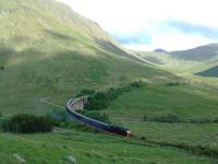 The Royal Scotsman heads north on the Horseshoe curve. The 47 accelerates out of the speed restriction over the viaducts.<br><br>[Ewan Crawford 01/07/2006]
