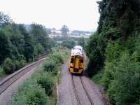 Heading north through the former Dinmore station heading for the twin tunnels.<br><br>[Ewan Crawford 10/07/2006]