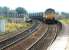 Coal empties from Longannet approaching Dunfermline in the summer of 2002. The train is heading for Halbeath sidings, where EWS 66228 will run round before heading back to Hunterston via the Forth Bridge.<br><br>[John Furnevel 29/08/2002]