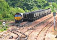 Empties ready to leave Halbeath sidings as a loaded train for Longannet pulls in alongside in June 2006.<br><br>[John Furnevel /06/2006]