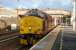 The early morning sun has just appeared on 11 July 2006 as EWS 37405, sporting a 40B (Immingham) shed plate, prepares to leave with the Edinburgh portion of the <I>Lowland</I> Caledonian Sleeper. EWS 90022 has just left with the Glasgow portion [see image 49805].<br><br>[John Furnevel 11/07/2006]